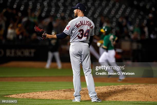 Jed Lowrie of the Oakland Athletics rounds the bases after hitting a home run off of Zach McAllister of the Cleveland Indians during the eighth...