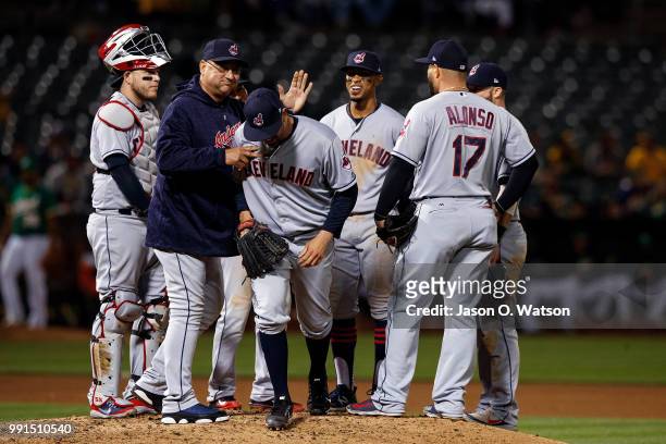 Oliver Perez of the Cleveland Indians is relieved by manager Terry Francona after facing a single batter who was intentionally walked during the...