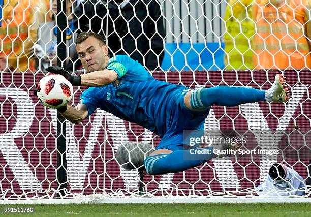 Igor Akinfeev of Russia saves the third penalty from Koke of Spain in the penalty shootout during the 2018 FIFA World Cup Russia Round of 16 match...