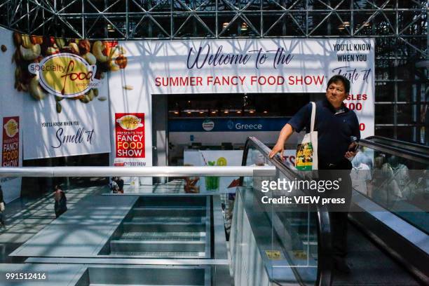 People attend The Summer Fancy Food Show at the Javits Center in the borough of Manhattan on July 02, 2018 in New York, The Summer Fancy Food Show is...