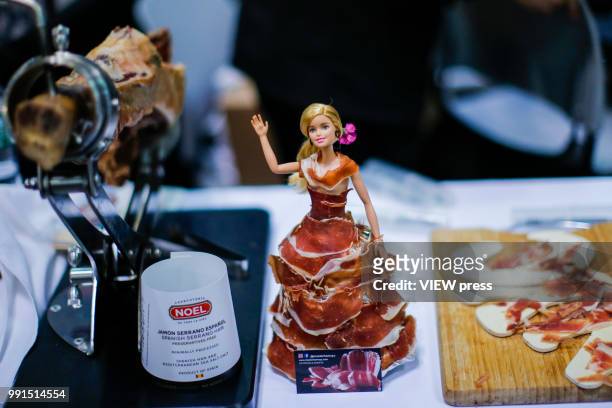 Barbie is covered with ham during The Summer Fancy Food Show at the Javits Center in the borough of Manhattan on July 02, 2018 in New York, The...