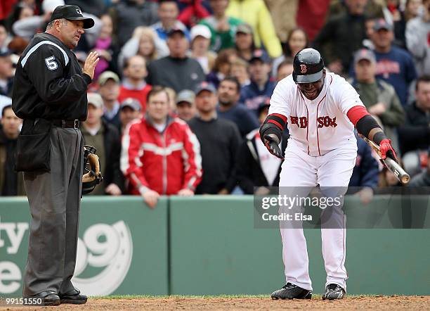 David Ortiz of the Boston Red Sox argues his call of a strikeout with home plate umpire Dale Scott in the ninth inning against the Toronto Blue Jays...