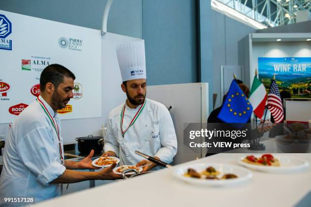 Chefs prepare pasta during The Summer Fancy Food Show at the Javits Center in the borough of Manhattan on July 02, 2018 in New York, The Summer Fancy...