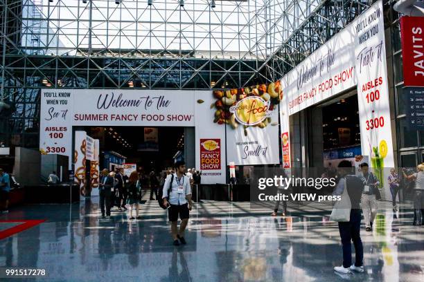 People attend The Summer Fancy Food Show at the Javits Center in the borough of Manhattan on July 02, 2018 in New York, The Summer Fancy Food Show is...