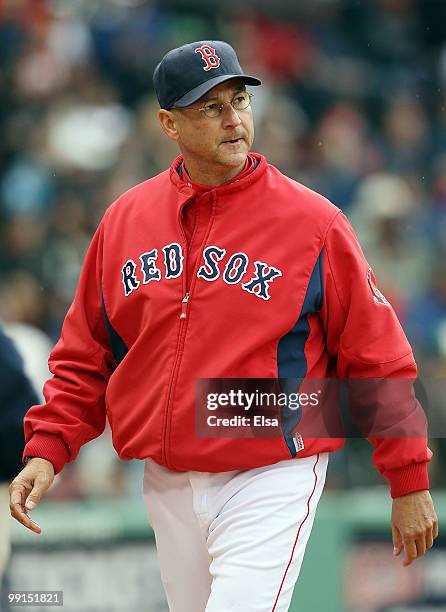 Manager Terry Francona of the Boston Red Sox leaves the field after being thrown out in the ninth inning against the Toronto Blue Jays on May 12,...