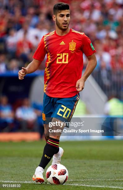 Marco Asensio of Spain runs with the ball during the 2018 FIFA World Cup Russia Round of 16 match between Spain and Russia at Luzhniki Stadium on...