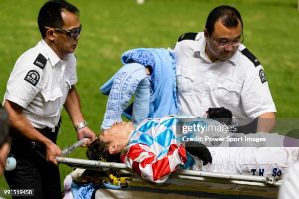 Jockey Ben So Tik-hung who rodeTelecom Man lies injured after fell of his horse during Hong Kong Racing at Happy Valley Racecourse on July 04, 2018...