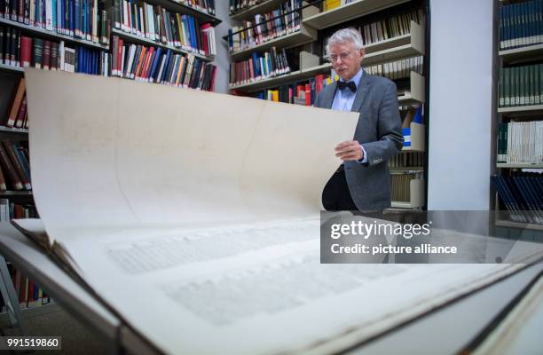 The former professor for Egyptology Erhart Graefe presents the big book "Description de l'Égypte" in Muenster, Germany, 16 November 2017. There are...