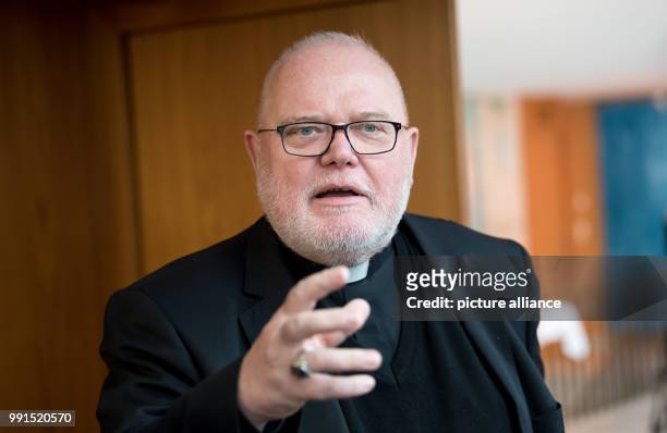 Munich's Cardinal and Archbishop Reinhard Marx speaks during a press conference regarding the results of the Freising Bishops Conference in Munich,...
