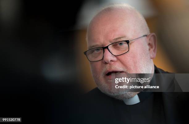 Munich's Cardinal and Archbishop Reinhard Marx speaks during a press conference regarding the results of the Freising Bishops Conference in Munich,...