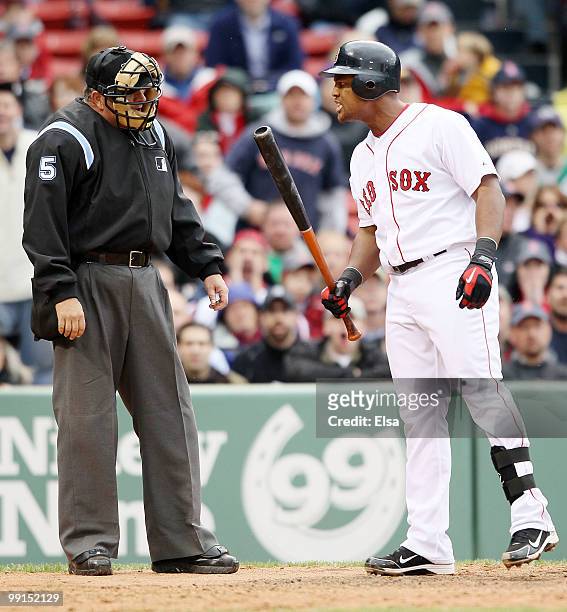 Adrian Beltre of the Boston Red Sox argues a strike with home plate upmpire Dale Scott in the ninth inning against the Toronto Blue Jays on May 12,...