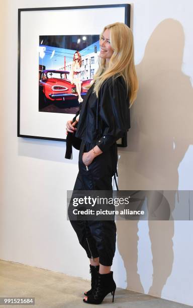 Model Claudia Schiffer during her own autograph hour on occasion of a photography exhibition regarding her career at the CWC gallery in Berlin,...