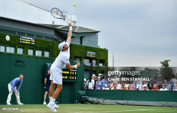 Luxembourg's Gilles Muller serves against Germany's Philipp Kohlschreiber during their men's singles second round match on the third day of the 2018...