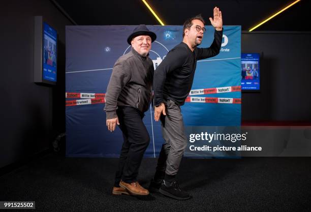 The actors Axel Prahl and Jan Josef Liefers can be seen at the cinematic premiere of the "Tatort Muenster" at the Cineplex in Muenster, Germany, 16...