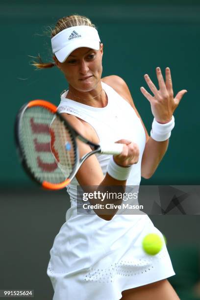 Kristina Mladenovic of France returns against Tatjana Maria of Germay during their Ladies' Singles second round match on day three of the Wimbledon...