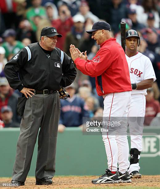 Manager Terry Francona of the Boston Red Sox argues a strike call made by home plate umpire Dale Scott in the ninth inning against the Toronto Blue...