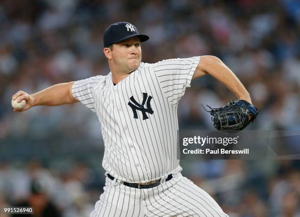 Pitcher Adam Warren of the New York Yankees pitches in the third inning of an MLB baseball game against the Boston Red Sox on June 30, 2018 at Yankee...