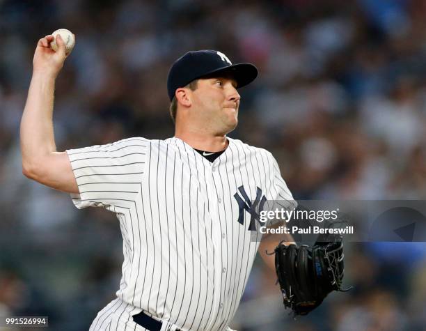 Pitcher Adam Warren of the New York Yankees pitches in the third inning of an MLB baseball game against the Boston Red Sox on June 30, 2018 at Yankee...