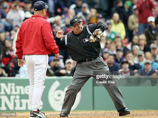 Manager Terry Francona of the Boston Red Sox is thrown out of the game by home plate umpire Dale Scott in the ninth inning against the Toronto Blue...