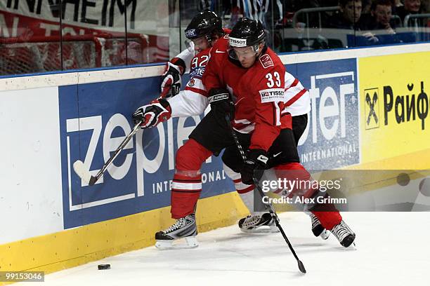 Steve Hirschi of Switzerland is challenged by Matt Duchene of Canada during the IIHF World Championship group C match between Canada and Switzerland...