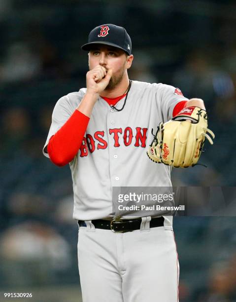 Pitcher Heath Hembree of the Boston Red Sox reacts as he pitches in relief in an MLB baseball game against the New York Yankees on June 30, 2018 at...