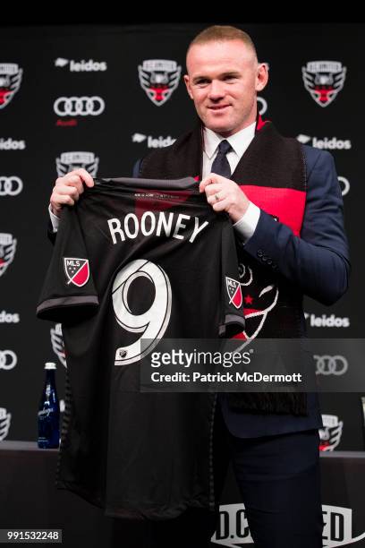 Wayne Rooney of DC United poses with his jersey during his introduction press conference at The Newseum on July 2, 2018 in Washington, DC.