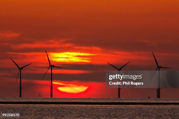 windfarm sunset - phil rogers stock pictures, royalty-free photos & images