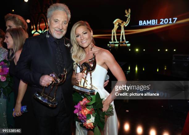 Award-winning singers Tom Jones and Helene Fischer standing onstage after the awards ceremony of the 69th edition of the Bambi media prize in Berlin,...