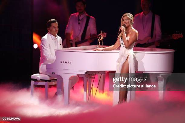 The award winner in the category "Music National", singer Helene Fischer, performs during the awards ceremony of the 69th edition of the Bambi media...