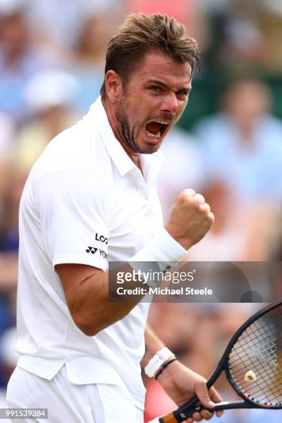 Stan Wawrinka of Switzerland celebrates a point against Thomas Fabbiano of Italy during their Men's Singles second round match on day three of the...
