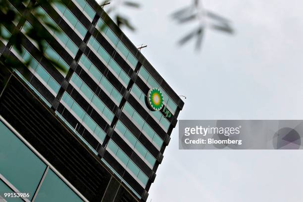 The BP Plc logo is displayed outside a BP office building in Houston, Texas, U.S., on Wednesday, May 12, 2010. BP Plc lowered its smaller "top hat"...