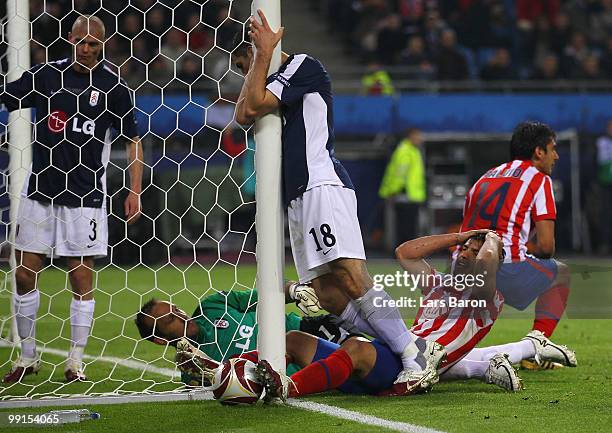 Sergio Aguero of Atletico Madrid reacts after failing to score against goalkeeper Mark Schwarzer of Fulham during the UEFA Europa League final match...