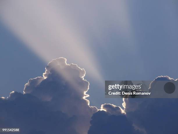 rays through the cloud - romanov stock pictures, royalty-free photos & images