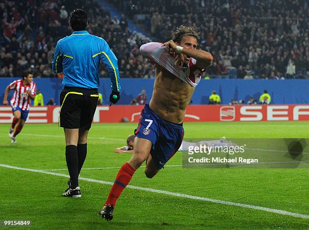 Diego Forlan of Atletico Madrid celebrates after scoring his team's second and winning goal in extra time during the UEFA Europa League final match...