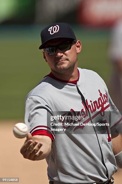 Ryan Zimmerman of the Washington Nationals tosses a baseball during a MLB game against the Florida Marlins in Sun Life Stadium on May 2, 2010 in...