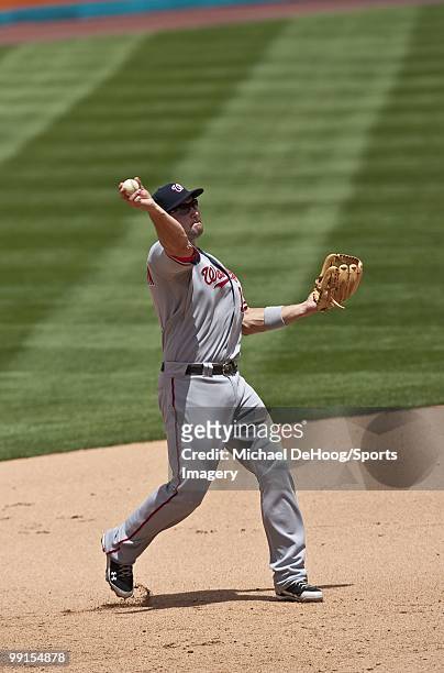 Ryan Zimmerman of the Washington Nationals throws to first base during a MLB game against the Florida Marlins in Sun Life Stadium on May 2, 2010 in...