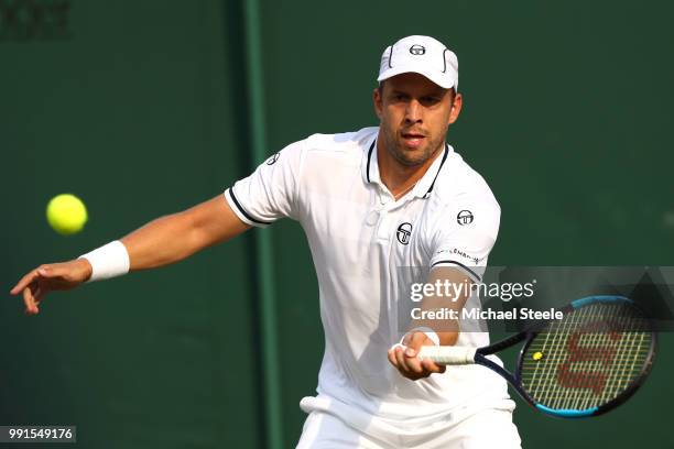 Gilles Muller of Luxembourg returns against Philipp Kohlschreiber of Germay during their Men's Singles second round match on day three of the...