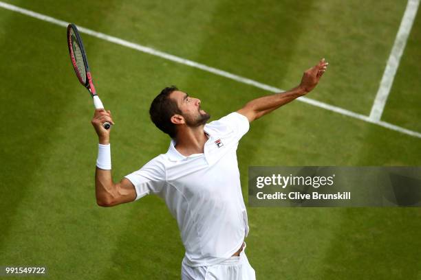 Marin Cilic of Croatia serves against Guido Pella of Argentina during their Men's Singles second round match on day three of the Wimbledon Lawn...