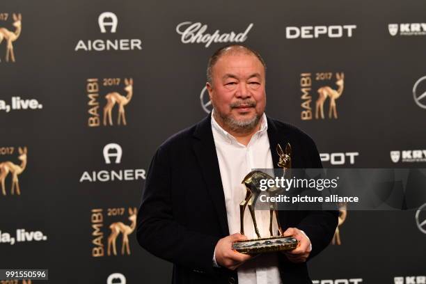 Artist Ai Weiwei showing his Bambi, which he won in the "Courage" category, in Berlin, Germany, 16 November 2017. The Hubert Burda Media company...