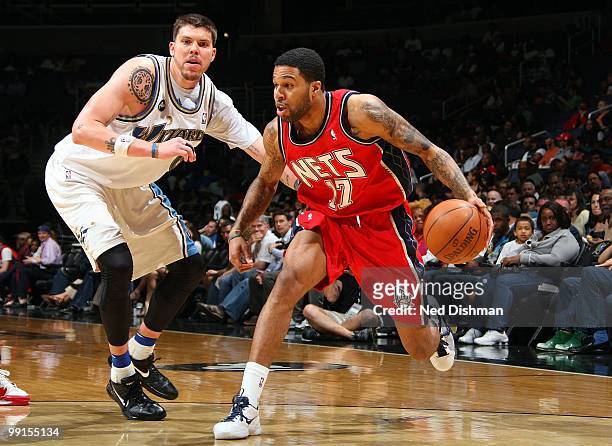 Chris Douglas-Roberts of the New Jersey Nets drives the ball against Mike Miller of the Washington Wizards during the game at the Verizon Center on...