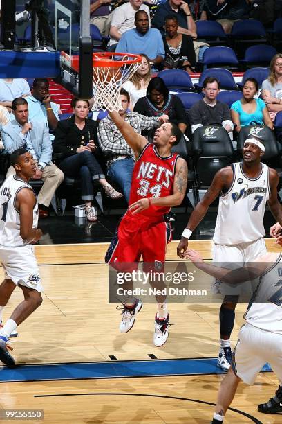 Devin Harris of the New Jersey Nets puts a shot up against the Washington Wizards during the game at the Verizon Center on April 4, 2010 in...