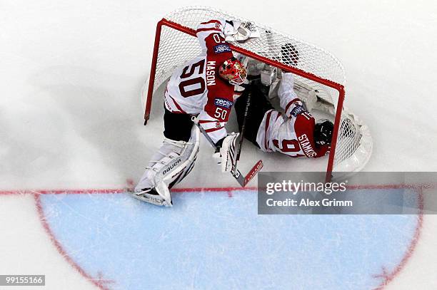 Steve Stamkos of Canada slides into the goal of his goalkeeper Chris Mason during the IIHF World Championship group C match between Canada and...