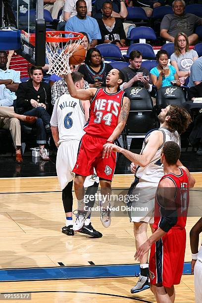 Devin Harris of the New Jersey Nets puts a shot up against the Washington Wizards during the game at the Verizon Center on April 4, 2010 in...