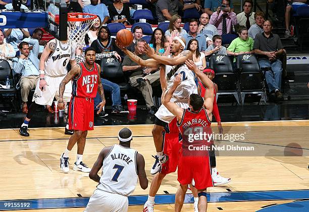 James Singleton of the New Jersey Nets puts a shot up against the Washington Wizards during the game at the Verizon Center on April 4, 2010 in...