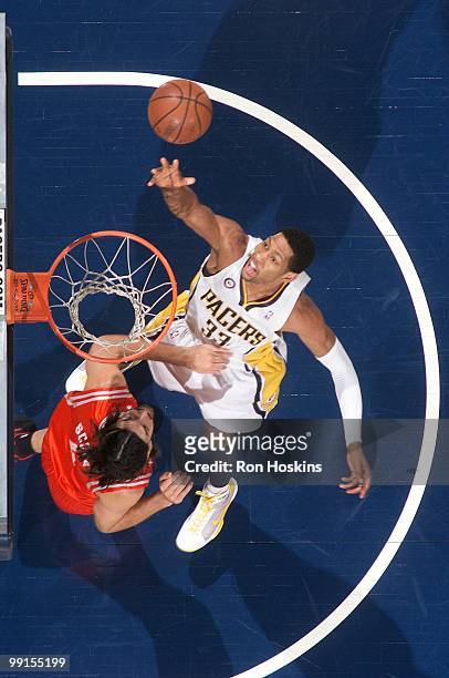 Danny Granger of the Indiana Pacers puts a shot up against the Houston Rockets during the game at Conseco Fieldhouse on April 4, 2010 in...