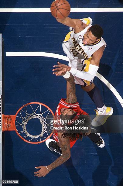 Danny Granger of the Indiana Pacers puts a shot up against the Houston Rockets during the game at Conseco Fieldhouse on April 4, 2010 in...