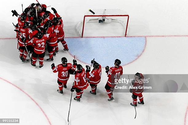 Players of Switzerland celebrate after winning the IIHF World Championship group C match between Canada and Switzerland at SAP Arena on May 12, 2010...