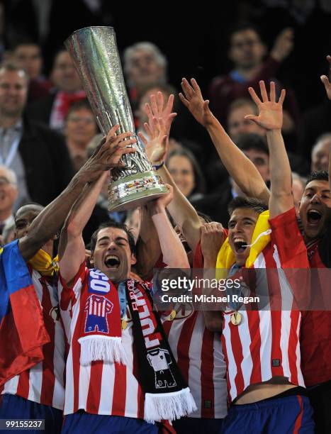 Antonio Lopez of Atletico Madrid lifts the UEFA Europa League trophy following his team's victory after extra time at the end of the UEFA Europa...