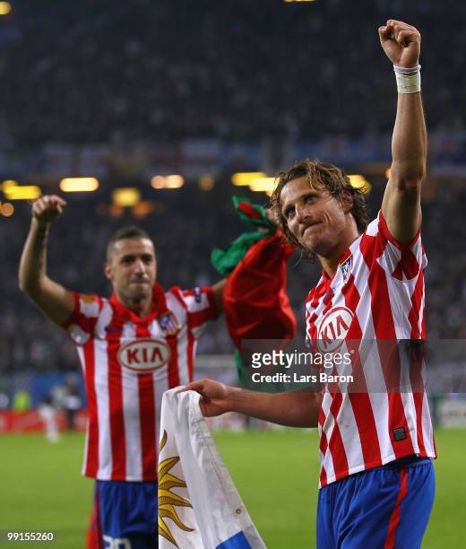 Diego Forlan of Atletico Madrid celebrates their victory with team mate Simao after the UEFA Europa League final match between Atletico Madrid and...