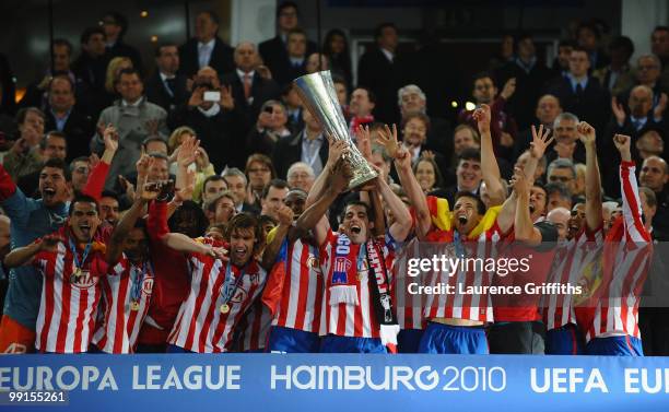 Atletico Madrid players celebrate with the UEFA Europa League trophy after extra time following their victory at the end of the UEFA Europa League...